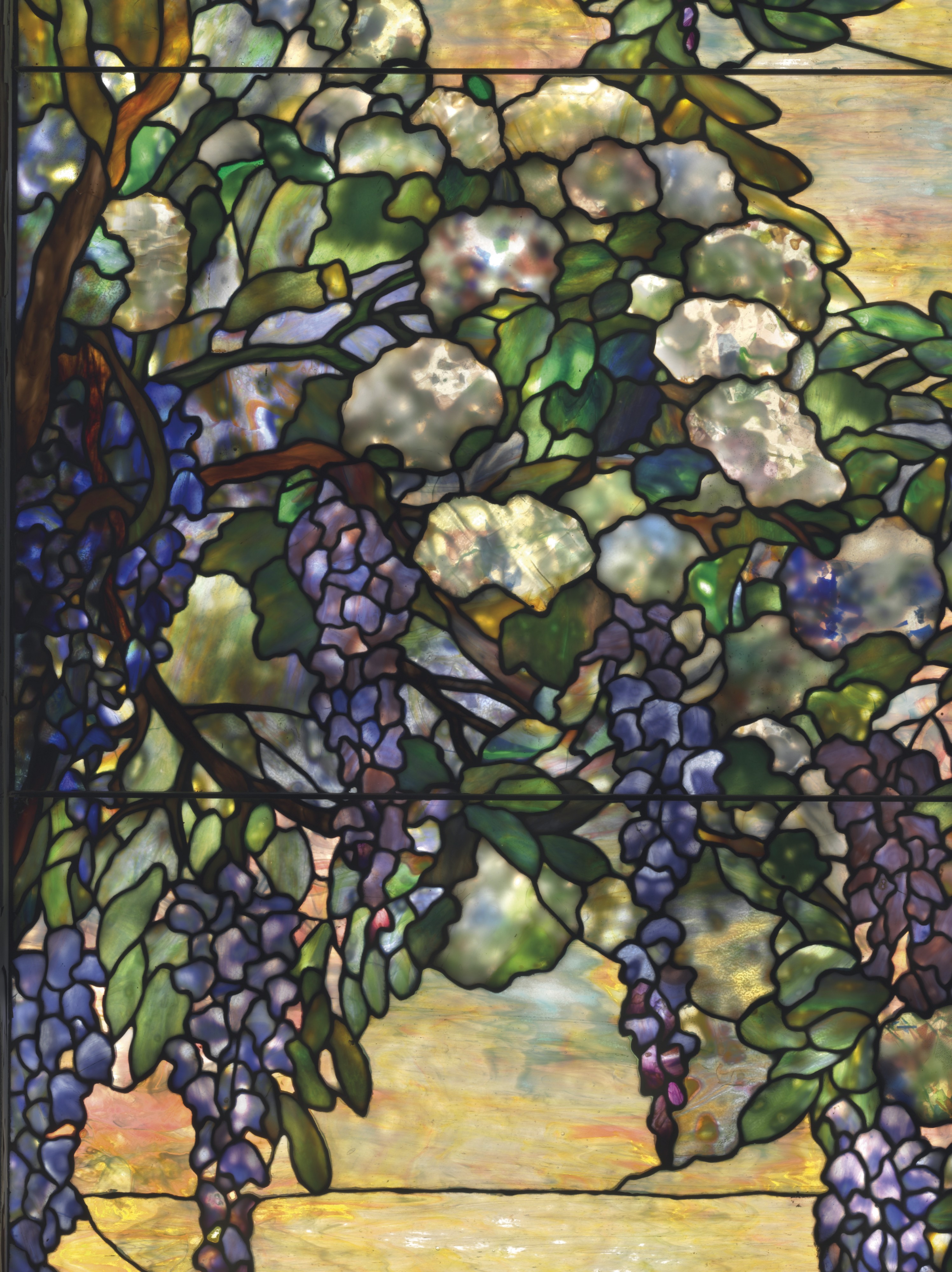 TIFFANY STUDIOS,A 'SNOWBALL AND WISTERIA' WINDOW, CIRCA 1902.Estimate: $200,000-300,000